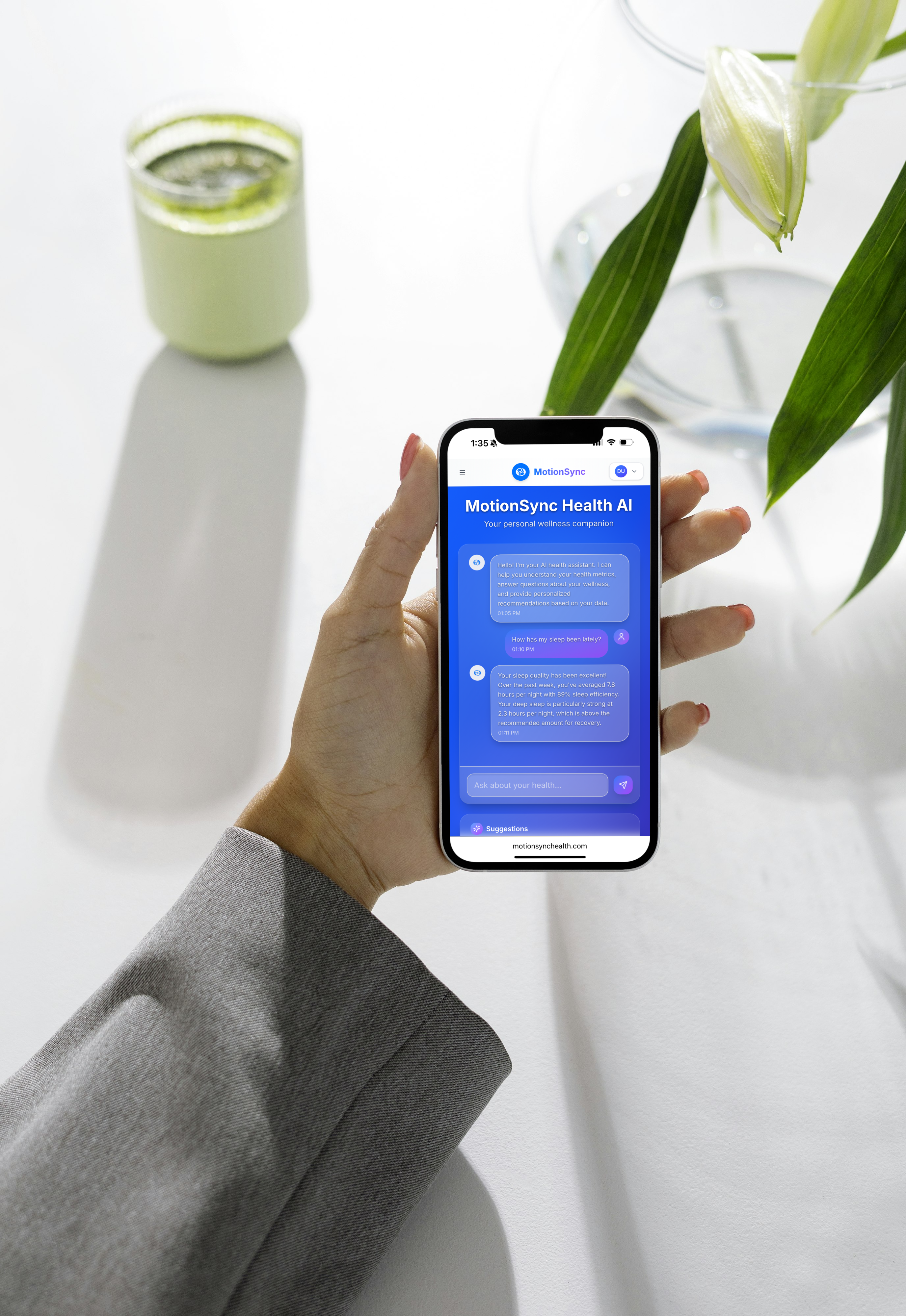 Woman in orange sweater smiling while using MotionSync app showing appointments